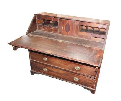 A George III mahogany rosewood and cross banded bureau,the fall flap opening to reveal a central door flanked by semi secret compartments, drawers and recesses, over two short and three long graduated drawers, raised on bracket feet, 110.5cm H, 122cm W, 5 - 4