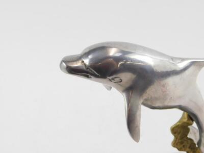 An aluminium and brass sculpture of a dolphin, modelled on sea weed, on a circular base, 25cm H. - 3