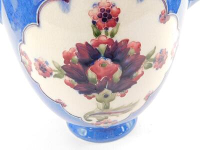 A Moorcroft Florian Ware twin handled jardiniere, decorated with reserves of flowers against a duck egg blue ground, William Moorcroft painted signature and impressed marks, 18cm H. - 2