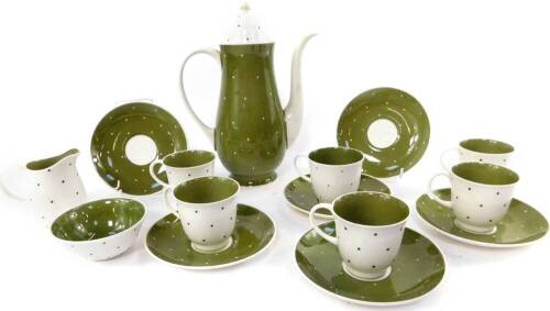 A Susie Cooper porcelain part coffee service, decorated in the Green Polka Dot pattern, comprising coffee pot, cream jug, sugar bowl, six cups and saucers.