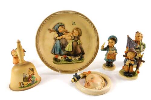 Four Hummel figures, comprising Is It Raining?, She Loves Me She Loves Me Not ...., Postman and Bird Duet, together with an Annual Bell 1978, all boxed, a Hummel circular Baby and Bee wall plaque, crown mark, and an Anniversary plate 1980 Spring Dance. (7