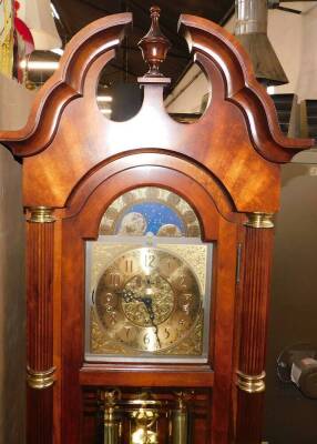 A Sligh American mahogany long case clock, the break arch dial with moon phase, chapter ring bearing Arabic numerals, subsidiary seconds dial, strike silent and Weston silent levers, three train eight day movement, with Westminster chimes, the case with s - 2