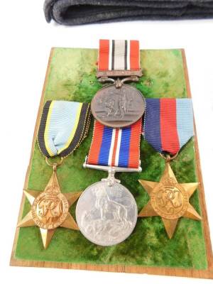 A WWII RAF Air Crew medal group, possibly to A J Scarr, comprising Air Crew Europe Star, 1939-45 Star and 1939-45 War Medal, together with a British Fire Services Association Medal awarded to A J Scarr, an RAF cap, further 1939-45 Medal and a Defence Meda - 2