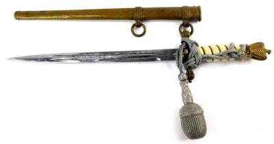 A Third Reich Kriegsmarine dagger, with eagle and swastika pommel, wire bound white grip, cross guard embossed with a furled anchor, engraved steel blade by E u F Horster, Solingham, with scabbard, 38cm L.