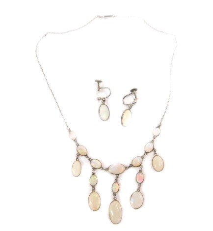 An early 20thC German silver and opal necklace, with five graduated drops, Ernst Treusch, Liepzig, together with a pair of screw earrings, cased.