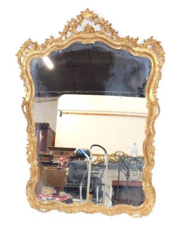 An 18thC style wall mirror, in gilt rococo style foliate scroll frame with pierced crest, 115cm H overall.