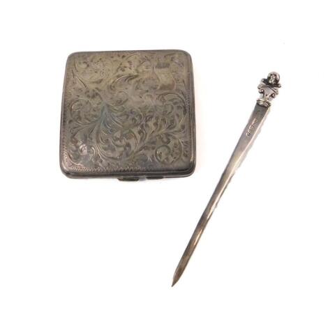 A George V silver cigarette case, of curvilinear form, engraved with foliate scrolls, reserve banner monogram engraved, Birmingham 1927, together with an Edward VII silver paper knife, with scull and cross bones terminal, Chester 1901.