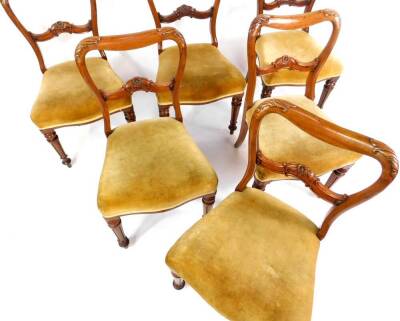 A set of six Victorian mahogany single balloon back dining chairs, with over stuffed seats, raised on fluted and lappet turned legs. - 2