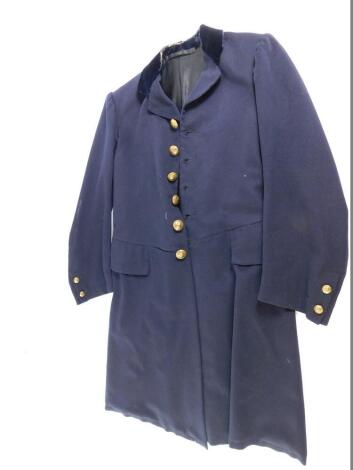 A Victorian domestic service tail coat, with brass buttons embossed with the crest of a heraldic rampant lion holding a scimitar.