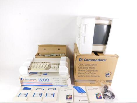 A Commodore Amiga A1200 computer, together with a Commodore Stereo monitor, both boxed. (2)