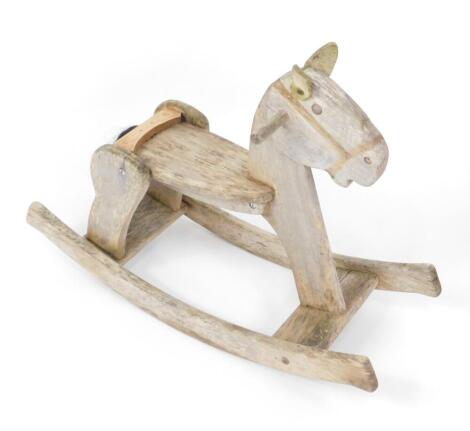 A rustic pine child's rocking horse, 85cm W.