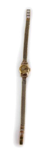 A gold Rolex Orchid lady's wristwatch, with small circular watch head, on a pleated design watch bracelet, with Rolex swiss movement marked Rolex 17 rubis, the back case marked 18K, the bracelet 9ct gold, the watch head 1.4cm diameter, the watch strap 18c