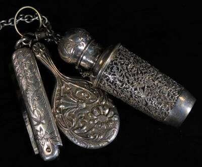 A late Victorian silver chatelaine, with heavy links and clips, set with various Edwardian and other pieces, chased pen knife, continental tape measure, bucket, perfume bottle, pencil, scribe set, vesta case, miniature purse, notebook, 6cm W, etc. Birming - 4