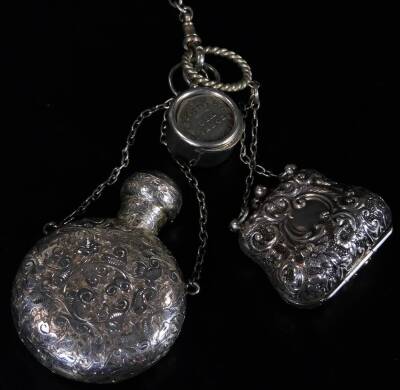 A late Victorian silver chatelaine, with heavy links and clips, set with various Edwardian and other pieces, chased pen knife, continental tape measure, bucket, perfume bottle, pencil, scribe set, vesta case, miniature purse, notebook, 6cm W, etc. Birming - 6
