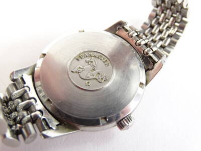 A 1960 Omega Seamaster gentleman's wristwatch, in steel case with champagne coloured dial and rectangular batons, the back decorated with a sea horse seamaster logo, with Omega strap, sold with original guarantee from model number 17044044, purchased in B - 9