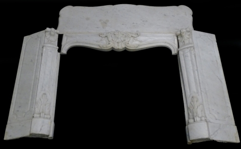 A French marble fire surround, the serpentine shaped mantel above a frieze carved with scrolls, leaves, etc., flanked by similar supports, etc., 136cm W.