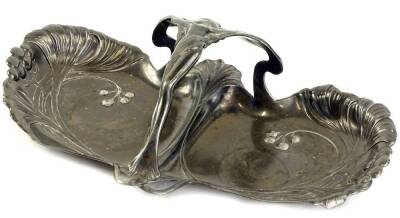 A late 19thC Art Nouveau pewter dish, of shaped form cast with flower heads, berries, etc., and with a handle cast with a fairy or nymph, in the manner of WMF, 31cm W.