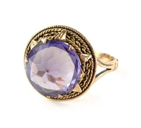 An amethyst dress ring, in yellow metal continental frame, unmarked, valued as 9ct, 4.4g.