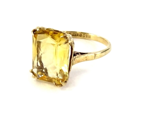 A 9ct gold dress ring, set with rectangular cut citrine in four double claw setting, and pierced open weave basket, ring size P, 3.7g all in.