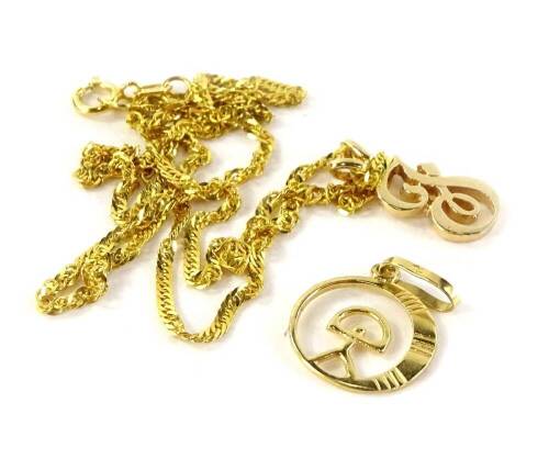 A 9ct gold pendant and chain on additional 18ct gold chain, the 9ct gold pendant in the form of the letter J, on rose gold, on a byzantine twist 9ct gold chain, 2.8g all in, and an Egyptian style 18ct gold pendant, 0.7g. (2)