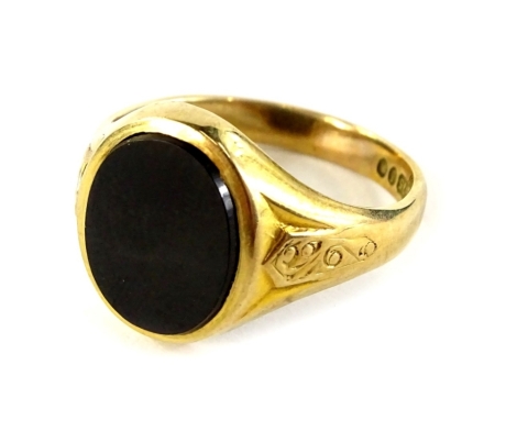 A 9ct gold gent's signet ring, with central oval black agate panel, and floral engraved scroll shoulders, ring size Q½, 4g all in, in J B Yabsley of London box.