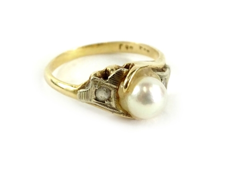 A pearl dress ring, set with central pearl, flanked by two CZ set shoulders, in white metal setting, the pearl crudely set with glue, on a yellow metal band, marked but unclea,r possibly 9ct, ring size N½, 3.3g all in.