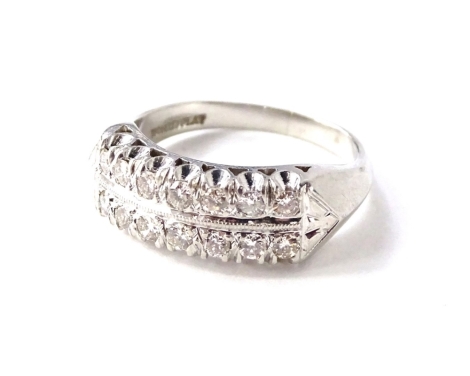 A platinum half hoop diamond eternity ring, with two rows of seven round brilliant cut diamonds, with plain polished triangular cross section shank, white metal, stamped 10% Irid Plat, tests as 900 grade platinum, ring size M, total carat weight 0.56cts, 