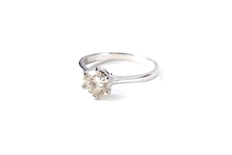 A diamond solitaire ring, set with round brilliant cut diamond, approx 1ct, in white six claw Tiffany style setting, in polished white metal shank, on white metal band, hallmarked 18ct Birmingham, ring size N, 3.87g all in. With previous insurance valuat