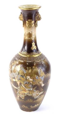 A late 19th/early 20thC Japanese earthenware two handled bottle chip vase, decorated in raised gilding with samurai warriors, signed to underside, 46cm H.