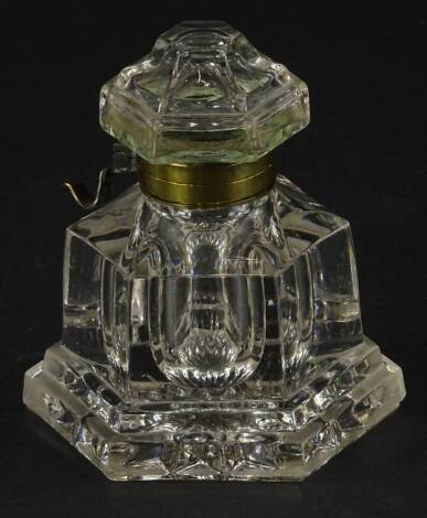 A Victorian moulded glass inkwell, with hinged lid and brass mount for a pen, 10cm W.