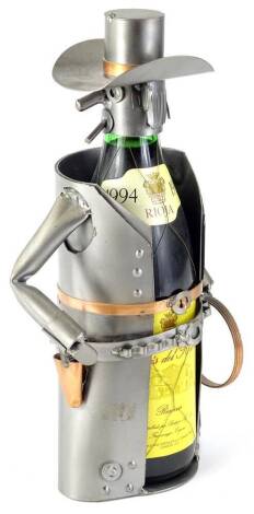 A bottle of 1994 Rioja, housed in a metal wine bottle holder, modelled in the form of a cowboy.