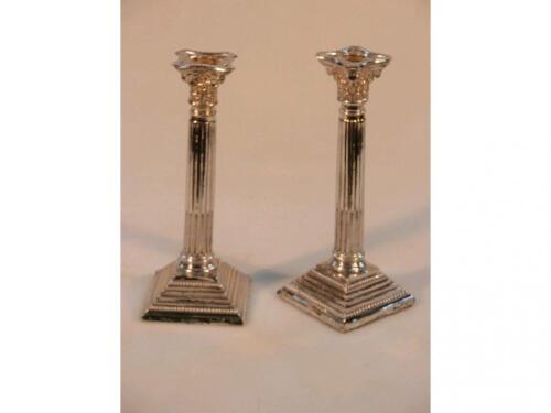 A pair of George V silver composite column table candlesticks