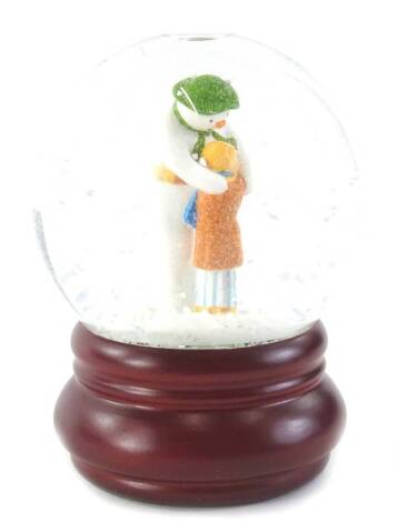 A Coalport characters Snowman limited edition snow globe, titled The Hug Snow Globe.