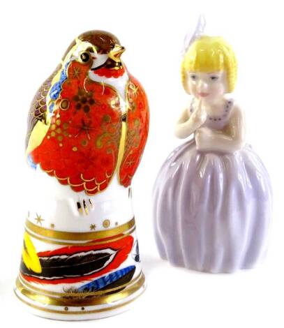 Two Royal Worcester porcelain candle snuffers, a robin and a limited edition of a young girl (2).