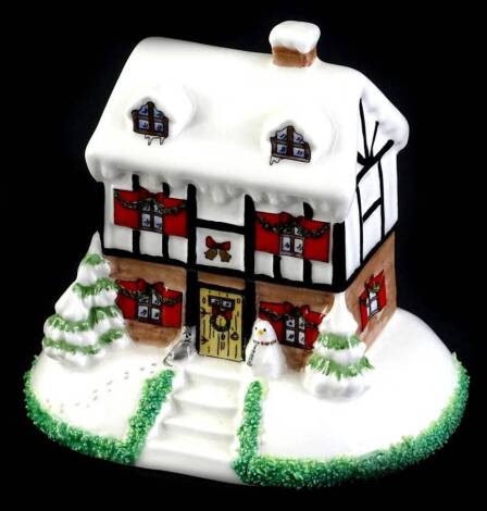 A Coalport Christmas limited edition Christmas Lodge, number 1314 of 2000, with box and certificate.