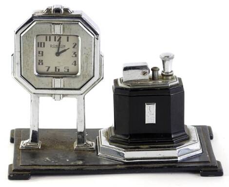 A Ronson Touch Tip table lighter, with chrome plated pull wind clock, on goal-post legs, and removable octette lighter, the black gun metal base with felt padded feet, 18cm long Auctioneer announce estimate increased £150-250