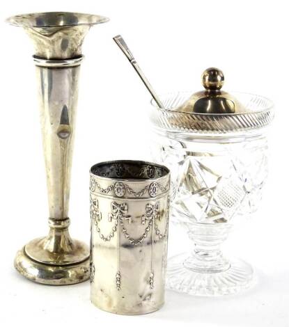 A collection of small silver, to include a cylindrical vase, lacking liner, cut glass preserve jar with silver lid and a bud vase etc.