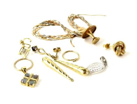 A small selection of gold and other jewellery, comprising a 9ct gold collar stud, a pair of 9ct gold hoops, a pair of gold spiral drops, three loose gold earrings, a tri-colour 9ct gold bracelet (AF), and a 9ct white gold pendant set with clear design cen