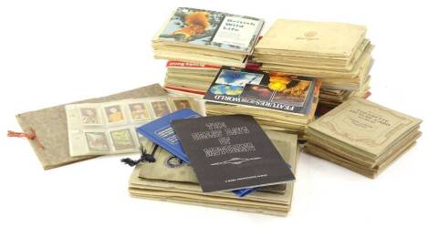 A large quantity of cigarette cards, some in albums, etc.