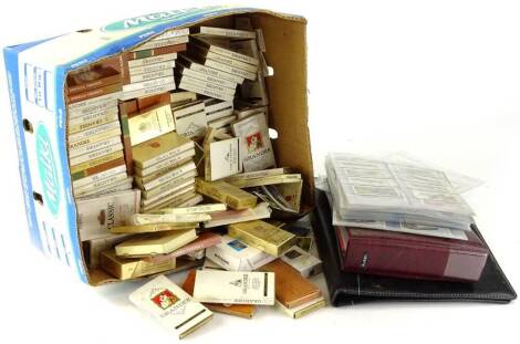 A large quantity of cigarette cards, cigarette and cigar packets, etc.