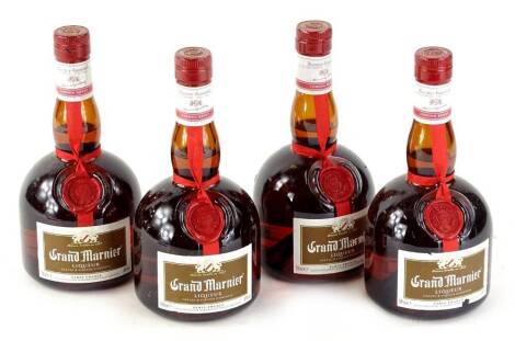 Four bottles of Grand Marnier.