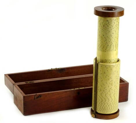 A Fullers spiral slide rule with brass mounts, turned wooden handle and fitted case with leather strap, 36cm W.