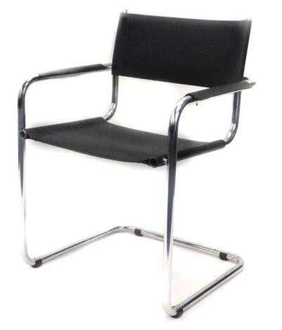 A chrome plated and leather armchair, with tubular frame in the manner of Marcel Breuer.