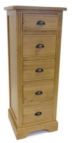 An ex shop display Hampton court oak chest of drawers, with six drawers in bracket feet, 47cm W.