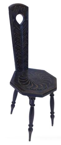 A late 19th/early 20thC stained oak spinning chair, with tapering pierced back and octagonal seat, with turned legs.