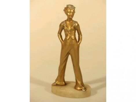 A 1930's Art Deco patinated metal figure of a standing female sailor