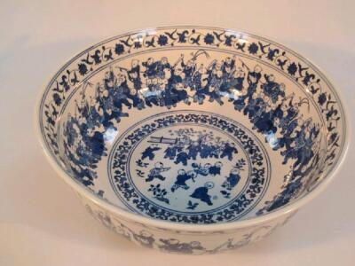 A 20thC Chinese blue and white punch with encircling bands of figure decoration