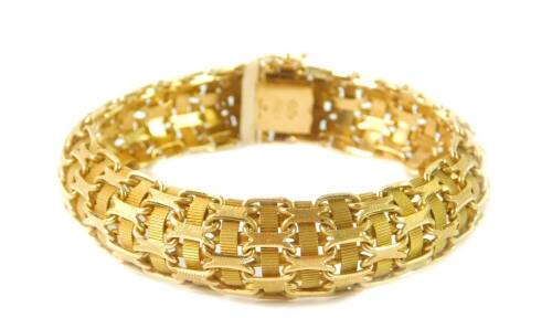 An 18ct gold bracelet, of interwoven Gothic design, on a snap clasp, 50g.