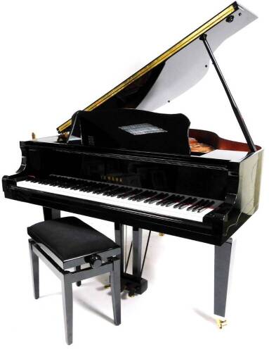 A Yamaha Baby Grand piano, in black with adjustable music rest, no. KJ 2737432 GB1 stamped Yamaha Corporation, 145cm W, 157cm D.