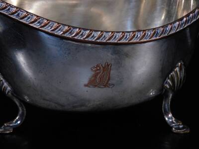 A 19th Old Sheffield Plate sauce boat, with S scroll acanthus capped handle, plain body with upper gadrooned border and triple shell capped hoof feet, 13cm H and two silver plated entree dishes. (3) - 2